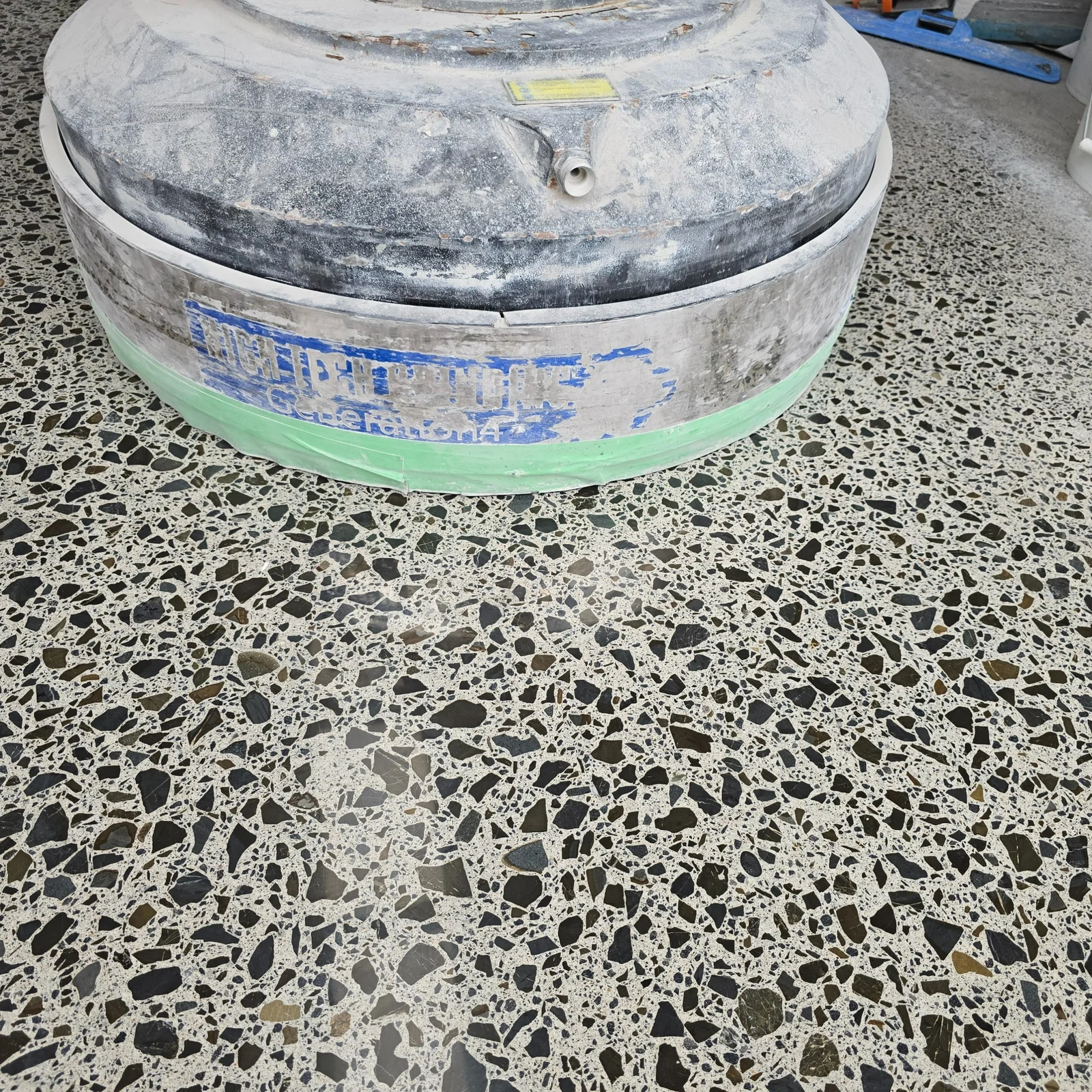 Close view of exposed aggregate polished concrete during finishing